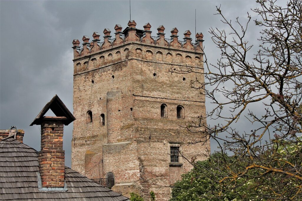 A square brick tower with a crenellated parapet at the top